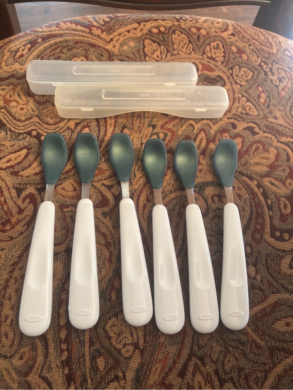 6 OXO infant spoons with 2 cases not used